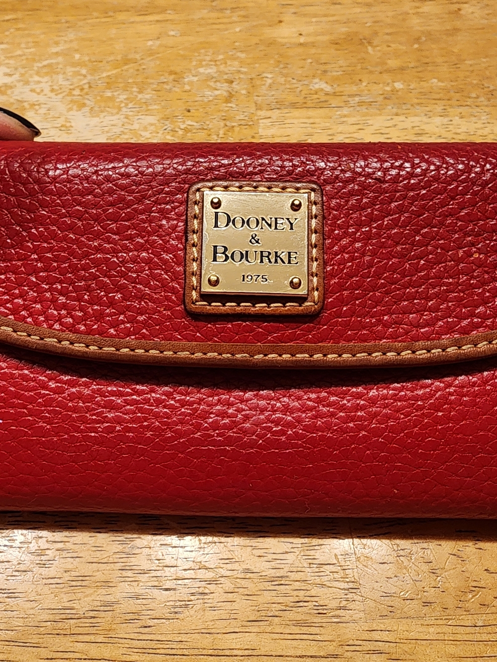 vibrant red Dooney & Bourke Pebble Grain Continental Clutch Wallet
